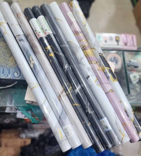 اصق رول استيكر  رخامي حراري يعطي